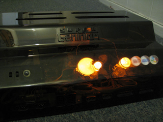 Illustration for article titled Super Genintari 4-in-1 Console Jams Nintendo, SEGA, and Atari
